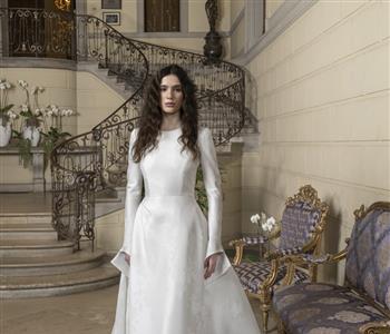 أسبوع العروس في نيويورك أحدث صيحات فساتين الزفاف للمحجبات لربيع وصيف 2025