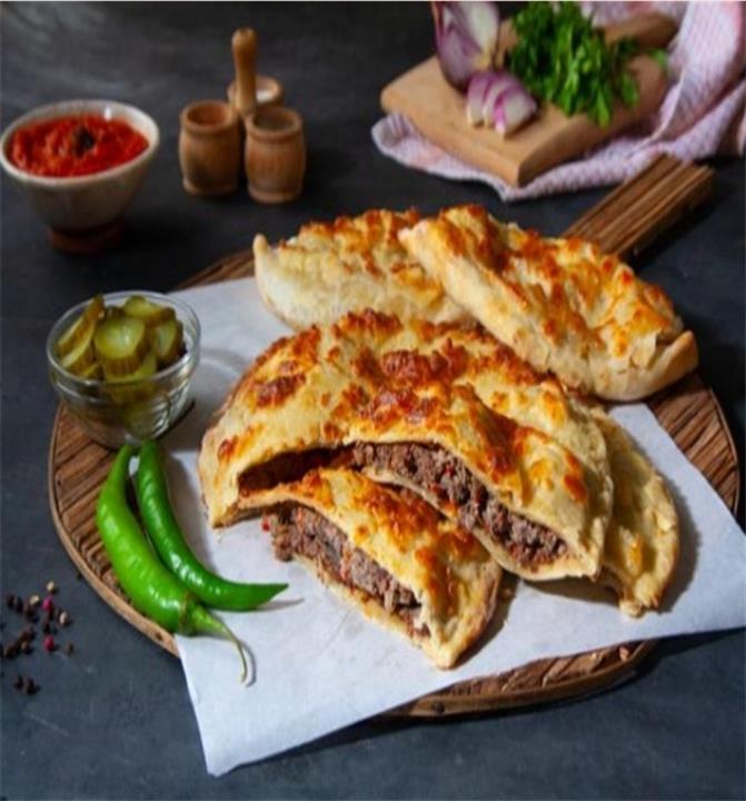 طريقة عمل حواوشي الطاسة.. سريع ولا ألذ